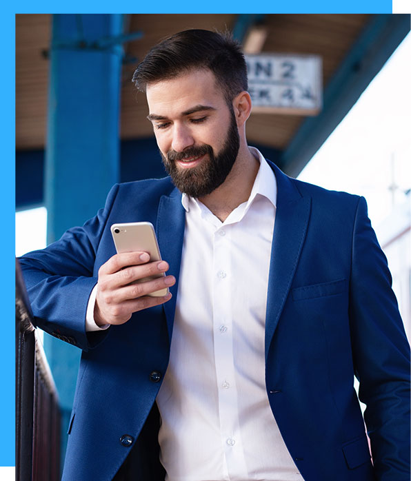 man holding and looking at smartphone